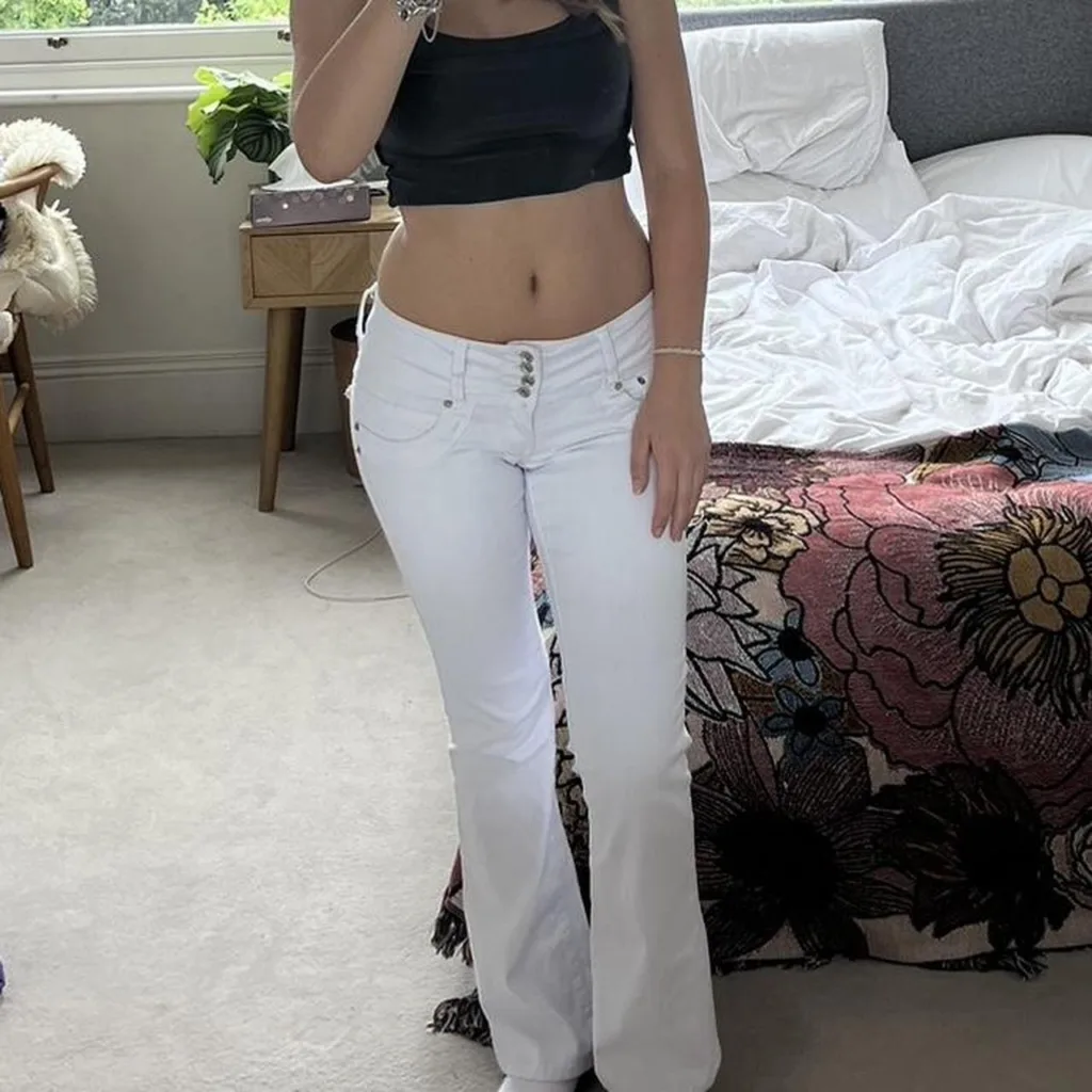 sexy girl wearing low rise tight white jeans