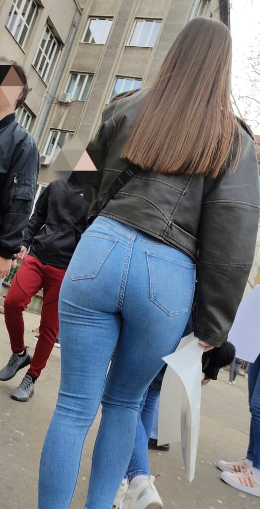 Candid in tight blue jeans