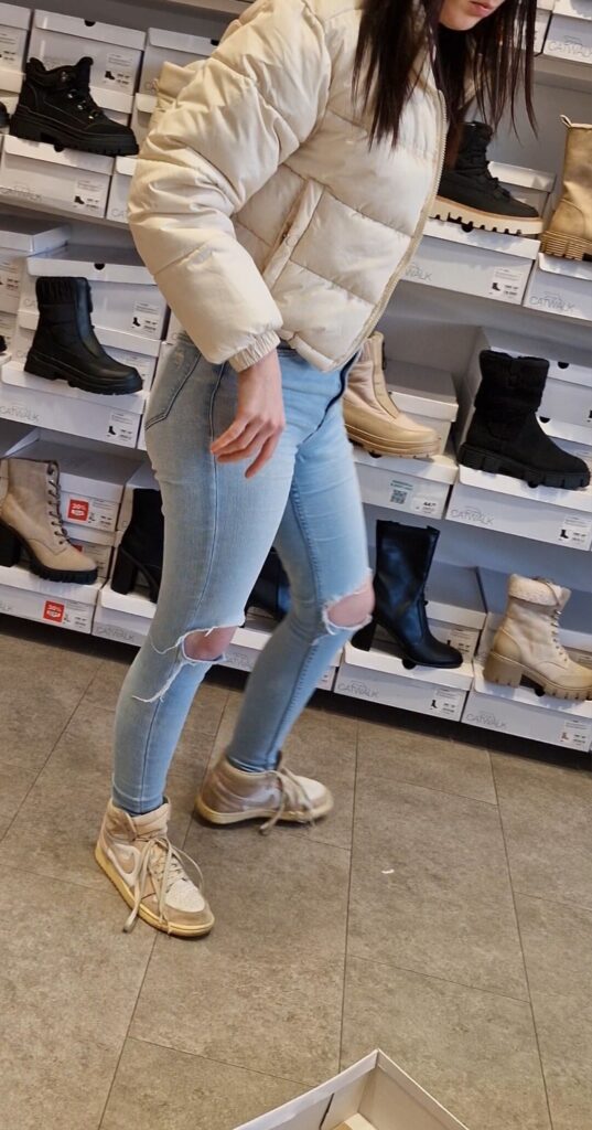 Girl wearing tight light blue jeans