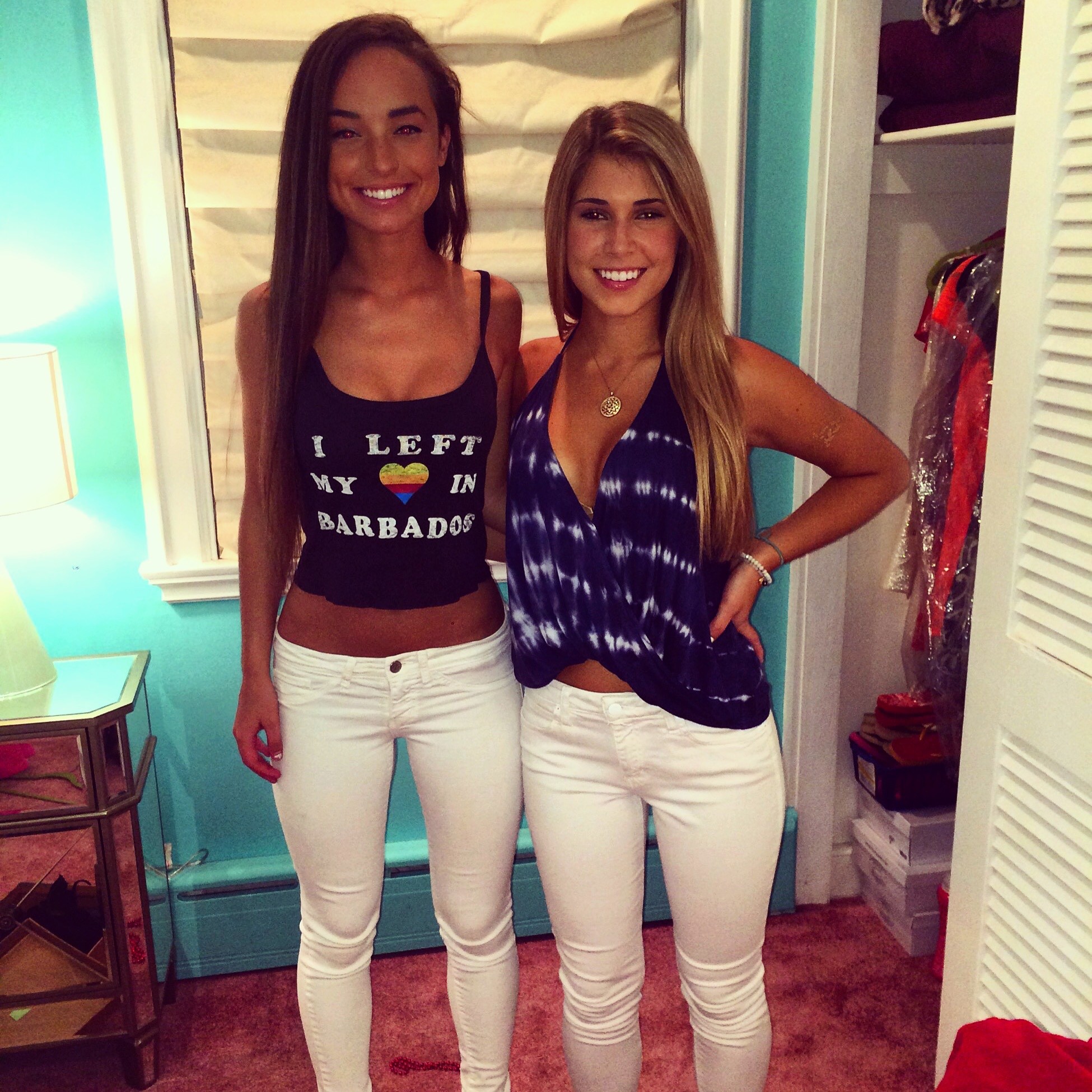 Two sexy girls in white tight jeans.