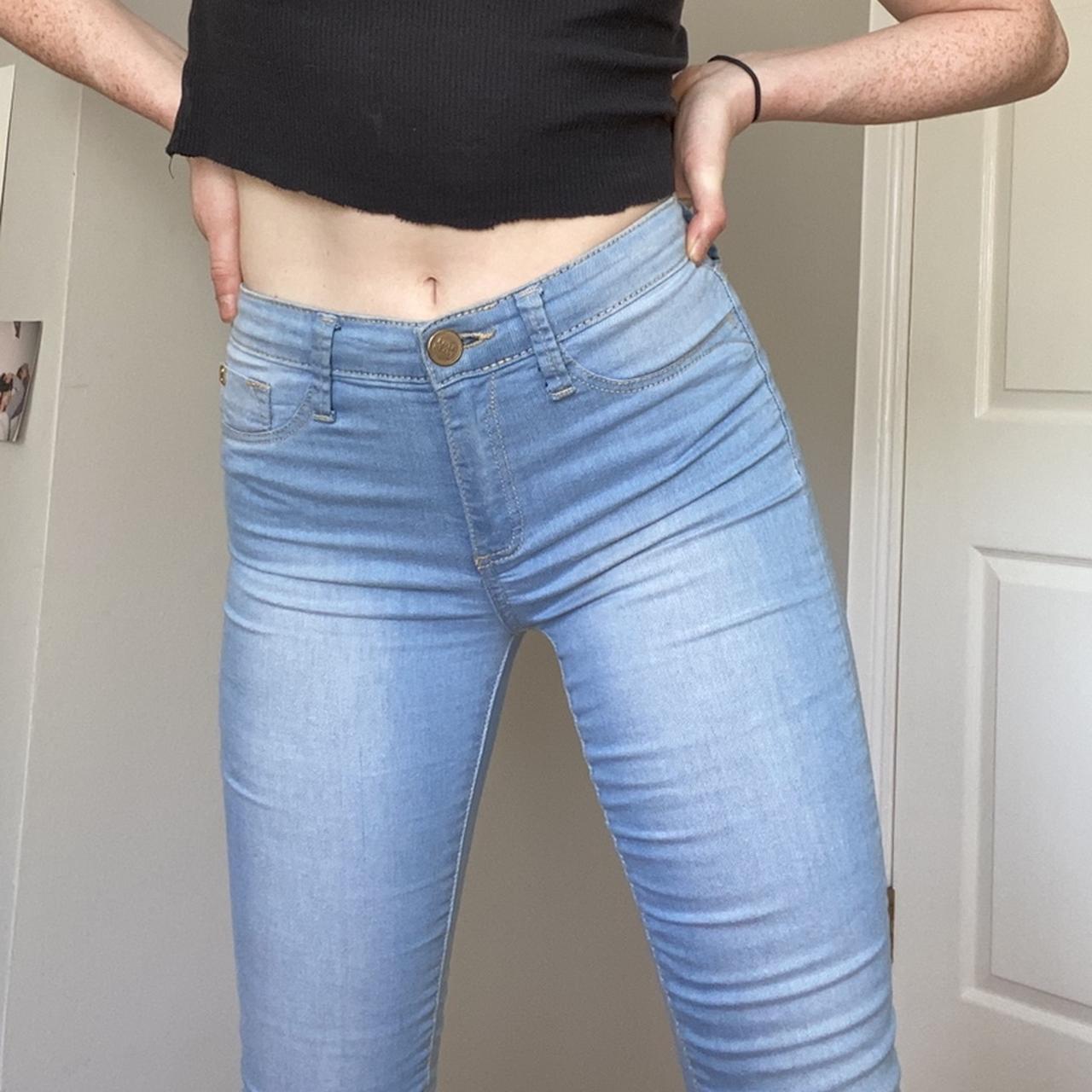A girl wearing sexy tight jeans, frontal view.