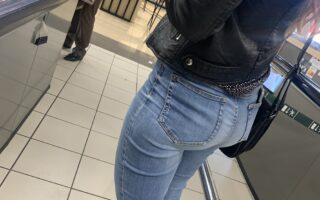 A sexy woman in tight blue jeans