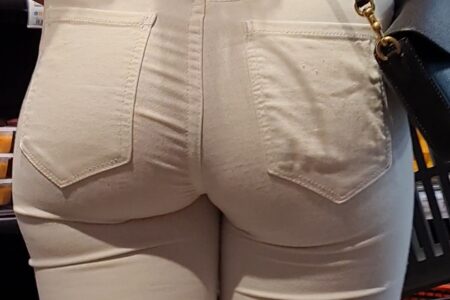 Muscular girl in tight white jeans