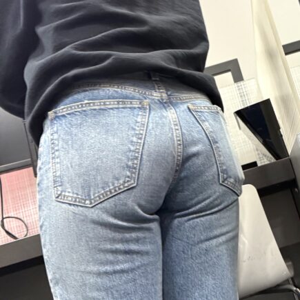 Geek girl in tight denim jeans